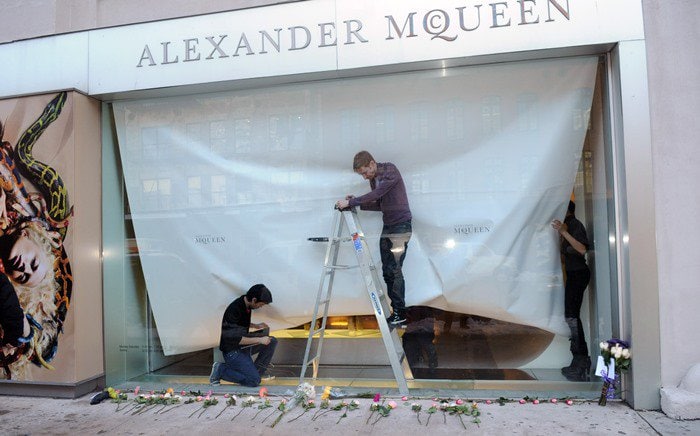 A makeshift memorial develops at Alexander McQueen's Manhattan store on the day the celebrated fashion designer was found dead at his London home