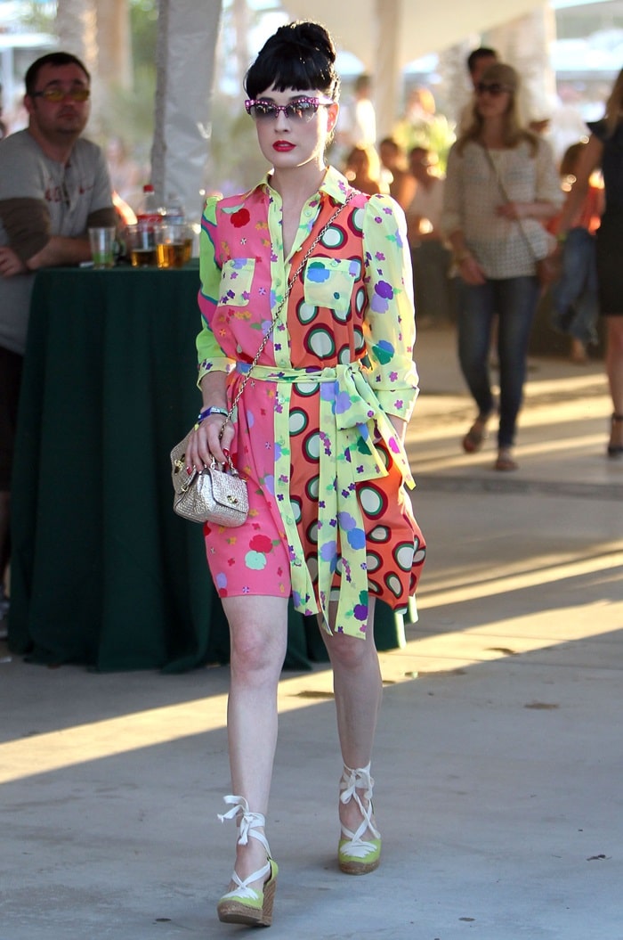 Dita Von Teese in a multicolored shirtdress paired with yellow lace up wedge espadrilles