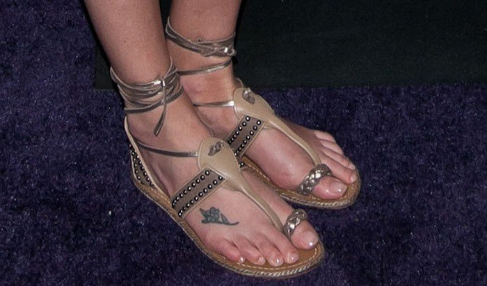 Charlize Theron wearing beautiful flat ankle wrap 'Hola Chica' toe ring sandals from Christian Louboutin