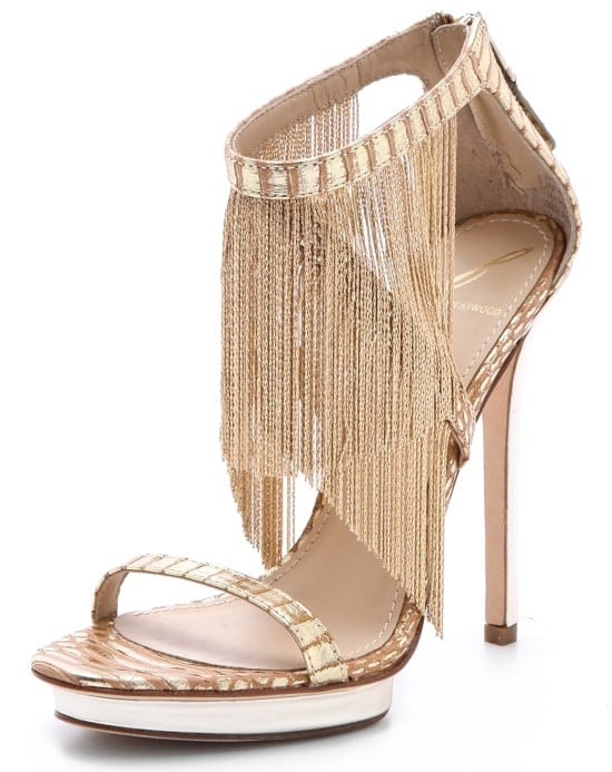 Delicate chain fringe swings from the crisscross ankle straps of these sexy platform sandals