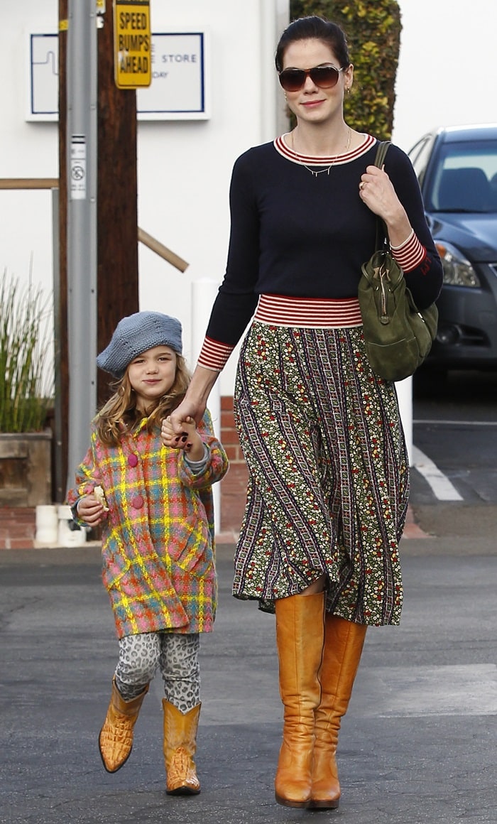 Little Willow wore a multicolored tweed coat, leopard print leggings, a grey beret and cowboy boots of the same color as her mom's