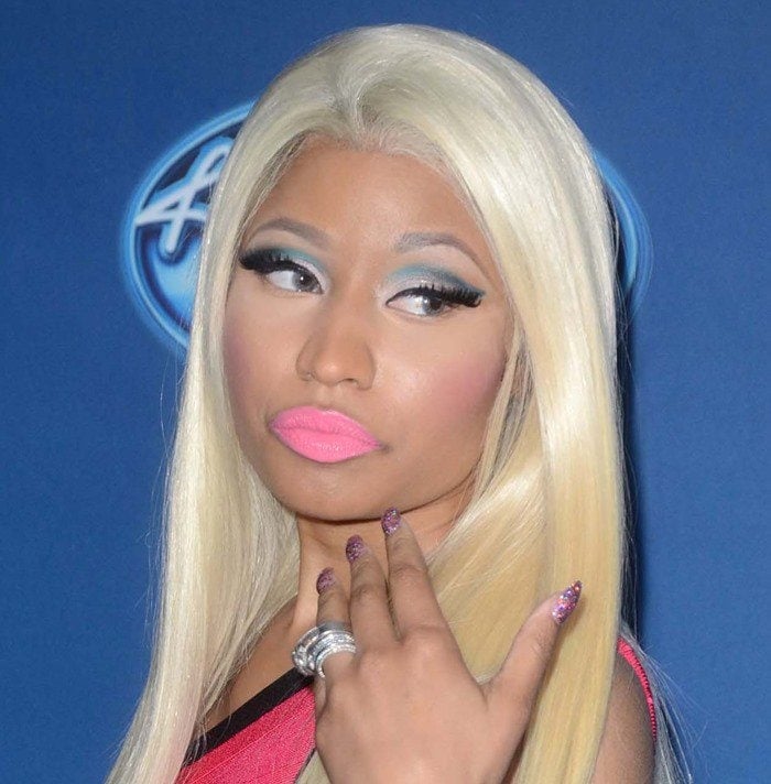 Nicki Minaj wearing a color-blocked Herve Leger bandage dress at the American Idol Season 12 premiere held at Royce Hall at University of California Los Angeles, in Los Angeles, California, on January 9, 2013