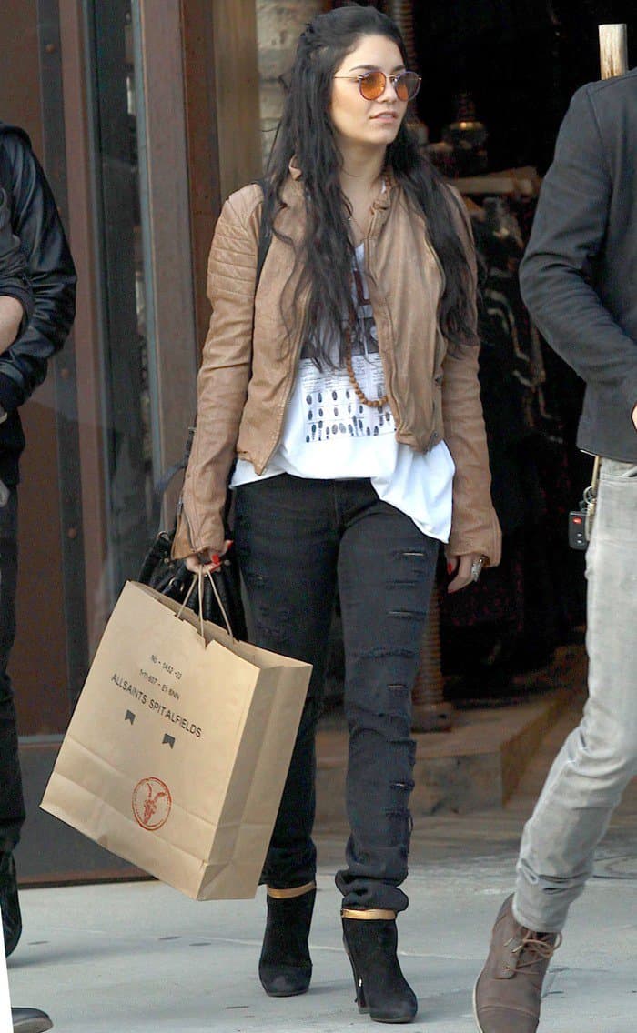 Vanessa Hudgens had on a buttery brown leather jacket paired over a loose white top and ripped skinny jeans