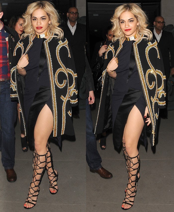 To cover up, Rita wore a coat from the Moschino Pre-Fall 2013 Collection with gold-and-white swirl embroideries