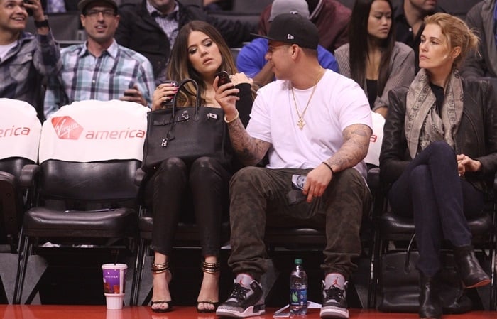Khloe Kardashian and Rob Kardashian watching the LA Clippers vs. Milwaukee Bucks game at the Staples Center in Los Angeles on March 6, 2013