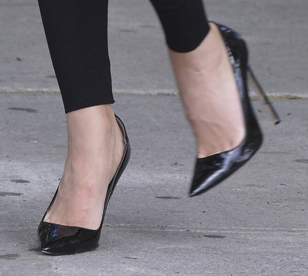 Wrapping up with Casadei black patent leather pumps
