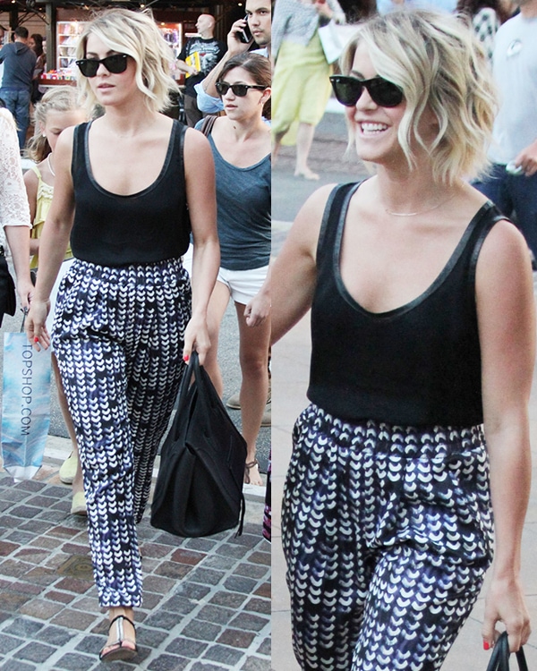 Julianne Hough wearing a black tank top with printed trousers