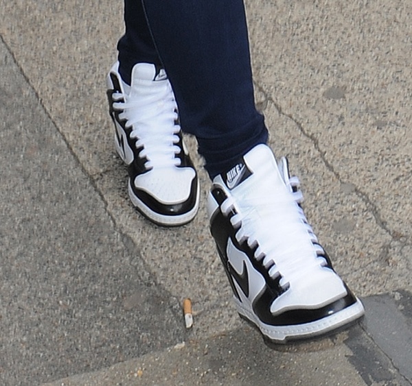Nicole Scherzinger wearing black-and-white Nike Dunk Sky Hi hidden wedge sneakers