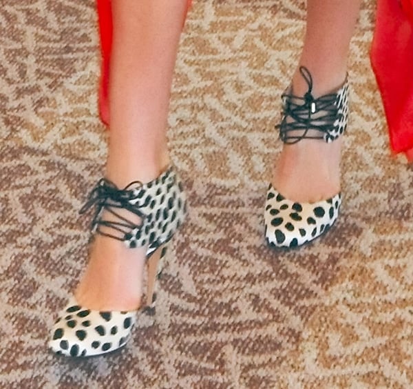 Miranda Kerr wearing leopard-printed crepe satin pumps