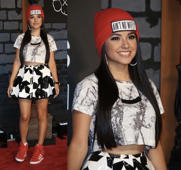 Becky G looked relaxed and ready to party in Adidas sneakers paired with a cute star-print skirt and a casual top