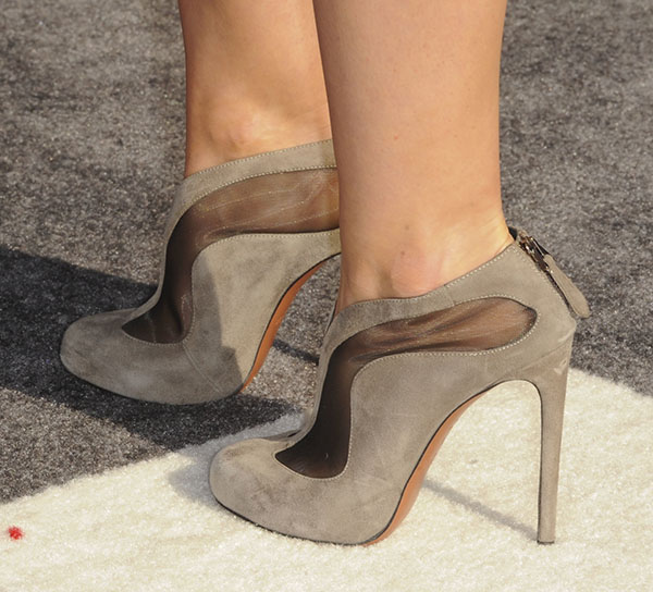 Hilary Duff wearing mesh-and-suede booties featuring taupe suede with mesh inserts, towering heels, and back zipper fastenings