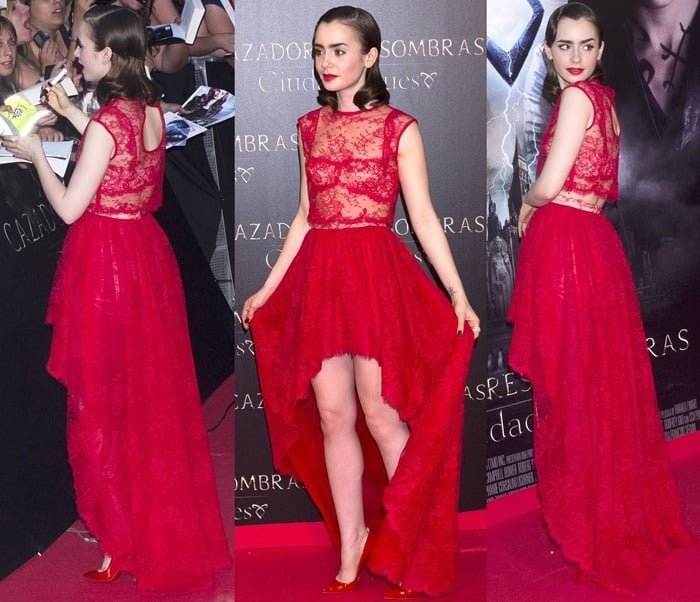 Lily Collins wearing a red lace Houghton frock at the premiere of 'Mortal Instruments: City of Bones' in Madrid