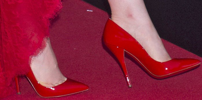Lily Collins wearing red pumps