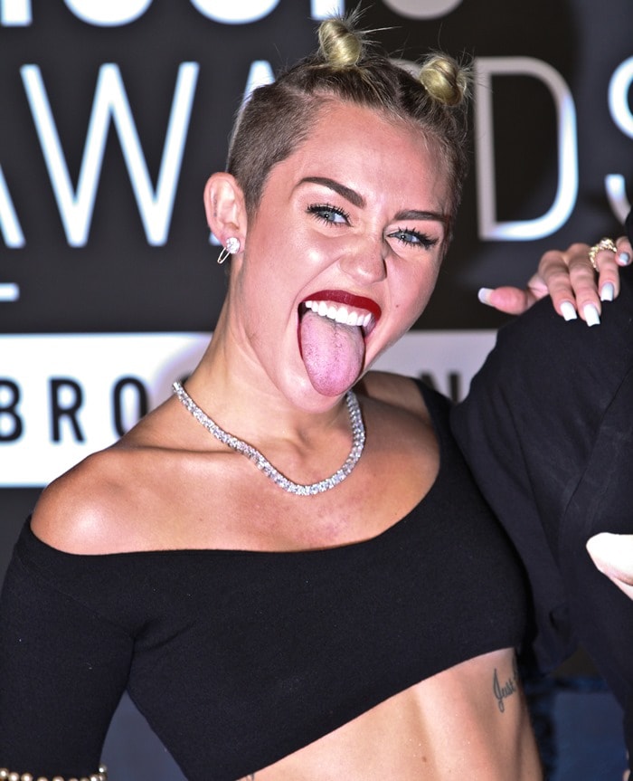 Miley Cyrus in a beaded spandex outfit paired with super platform sandals at the 2013 MTV Music Video Awards in Brooklyn, New York, on August 25, 2013