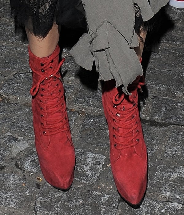 Georgia May Jagger wearing red pointy-toe boots