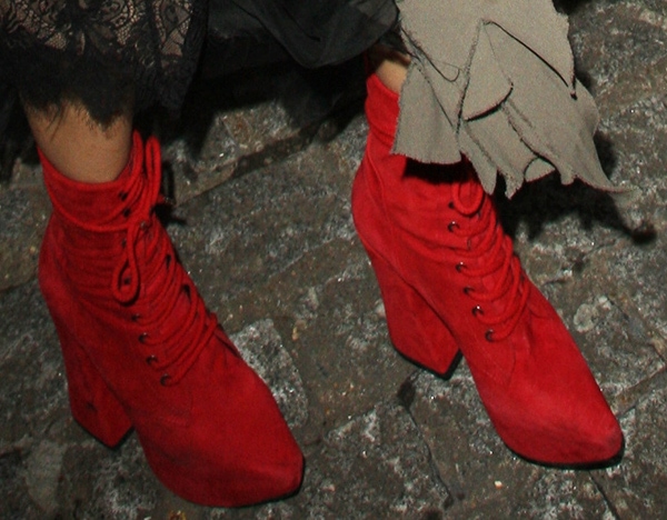 Georgia May Jagger wearing red pointy-toe boots