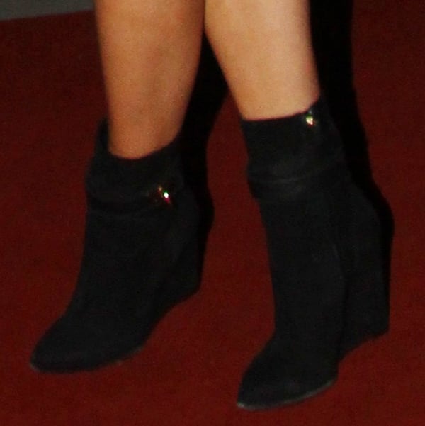 Rita Ora wearing black ankle wedge booties by Givenchy