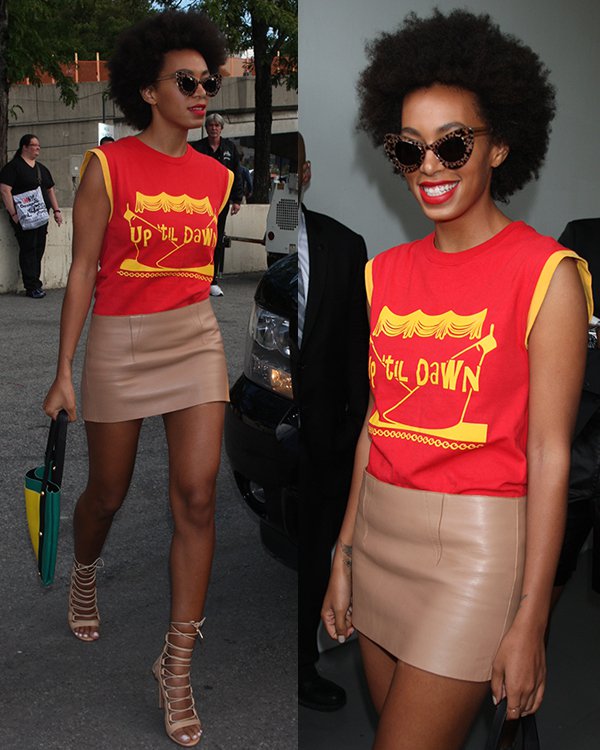 Solange Knowles in a yellow-and-red muscle tee with a beige leather skirt