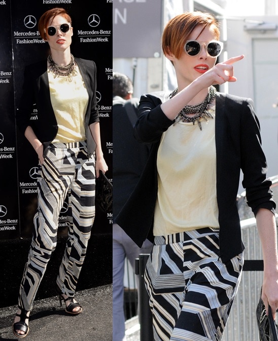 Coco Rocha channeling a more masculine style and pairing them with strappy sandals as she heads to a fashion show during 2014 Mercedes-Benz Fashion Week in New York City on September 9, 2013