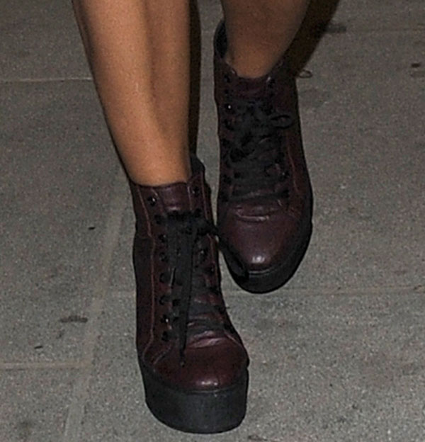 Vanessa White wearing platform lace-up boots