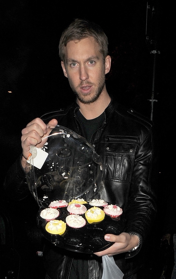 Calvin Harris offering out cakes to photographers