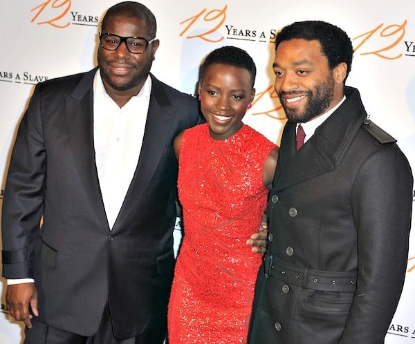 Lupita Nyong'o with director Steve McQueen and co-star Chiwetel Ejiofor at the premiere of 12 Years a Slave held at UGC Normandie in Paris, France, on December 11, 2013