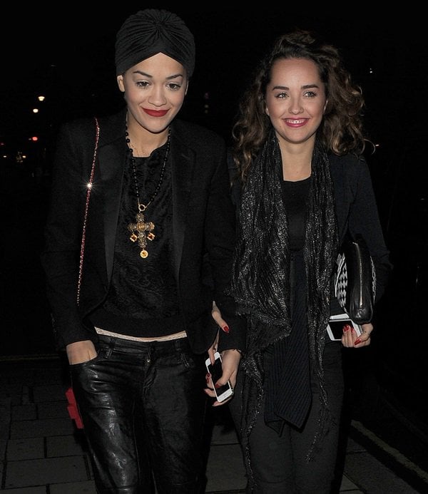 Rita Ora wearing a classic black silk and wool blazer by Saint Laurent and a DKNY paisley lace long-sleeve pullover
