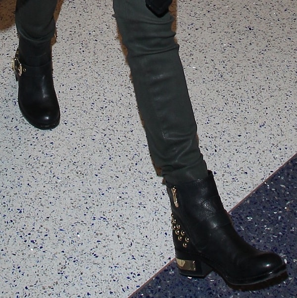 Anna Kendrick's studded gold-heeled boots
