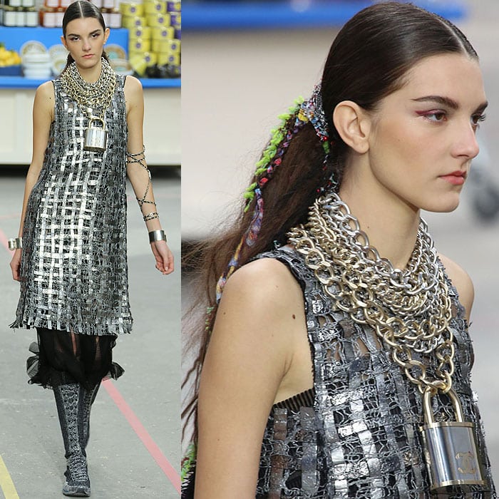 A model wearing a gigantic padlock and chain necklace at the Chanel fall 2014 fashion show held during Paris Fashion Week Womenswear Fall/Winter 2014–2015 in Paris, France, on March 4, 2014