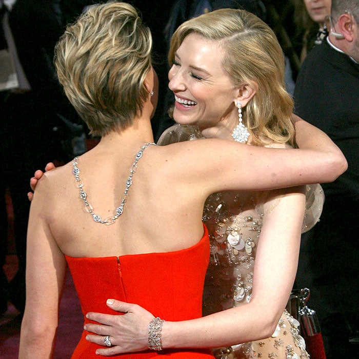 Jennifer Lawrence and Cate Blanchett greeting and hugging each other at the 86th Annual Academy Awards held at Dolby Theatre in Hollywood, California, on March 2, 2014