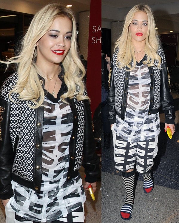Rita Ora in a Fausto Puglisi bomber jacket featuring geometric print and leather sleeves with gold-tone and crystal embroidery
