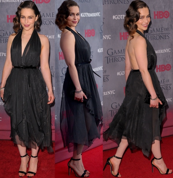 Emilia Clarke showed off her smooth shoulders and toned back in a black belted halter handkerchief dress from Donna Karan's Fall 2014 collection