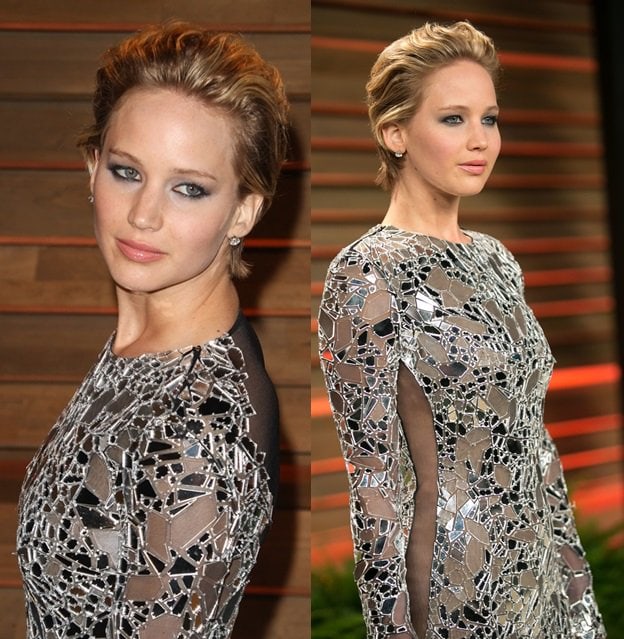 Jennifer Lawrence getting a little risque by wearing a Tom Ford mirror-detailed party dress at the Vanity Fair Oscar Party held at Sunset Plaza in West Hollywood on March 2, 2014