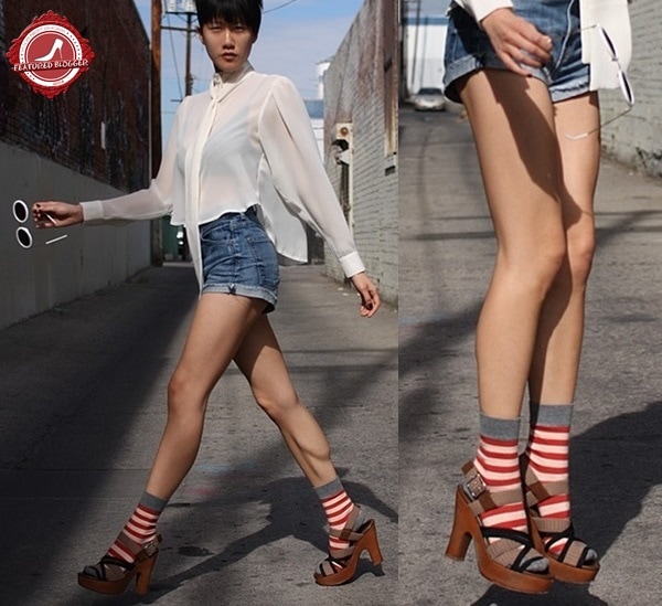 Paanie Pho sporting platform sandals and contrasting striped red socks
