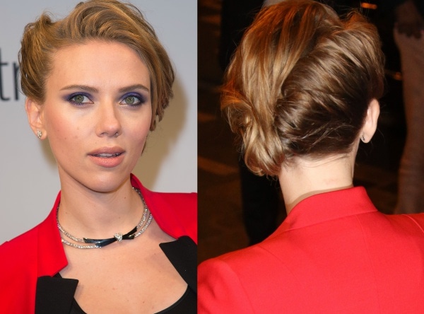 Scarlett Johansson styled her golden locks in an elegant updo, and she carried a fun and quirky clutch decorated with a pair of lips