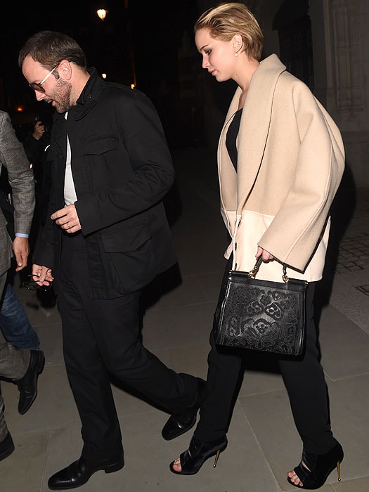 Tom Ford and Jennifer Lawrence exiting the Chiltern Firehouse in London, England, on April 25, 2014