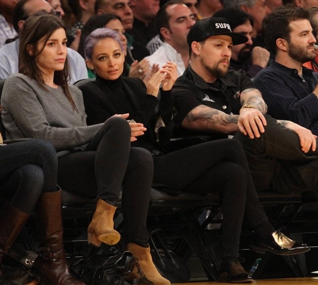 Nicole Richie wearing Celine metal plate oxfords to the Lakers vs. Blazers game in Los Angeles on April 1, 2014