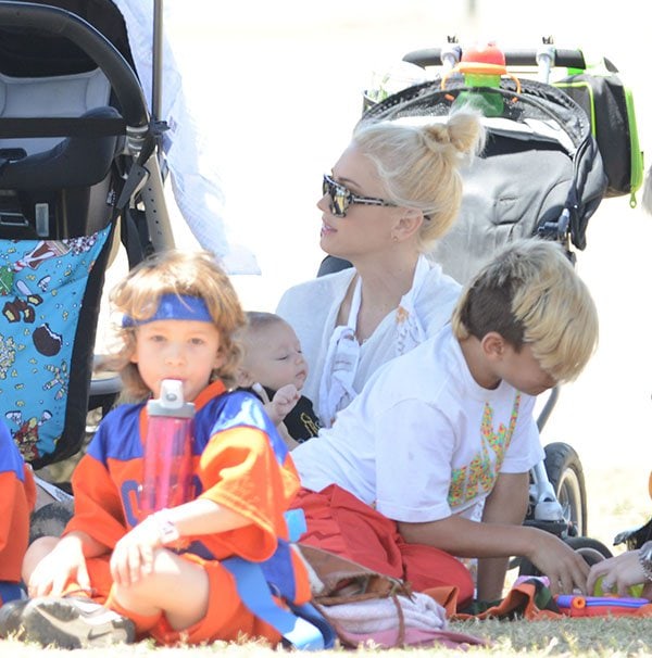 Gwen Stefani and new baby Apollo Rossdale watch Stefani's older sons play sports