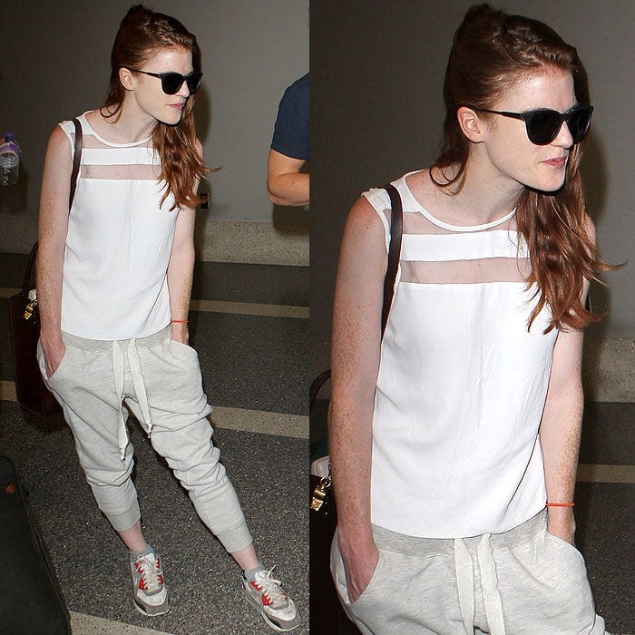 Rose Leslie in a styled-down silk top and pushed-up sweatpants