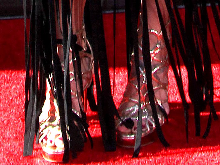 Sydney Leroux wearing gold cage sandals