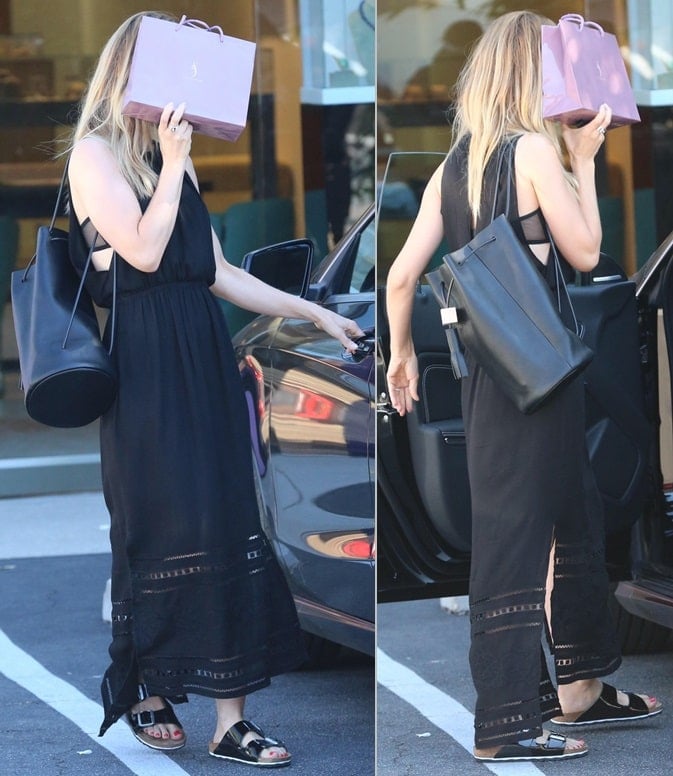 Mena Suvari sported a long black frock with the sandals while buying a gift at Suzanne Felsen Jewelry Store in Los Angeles