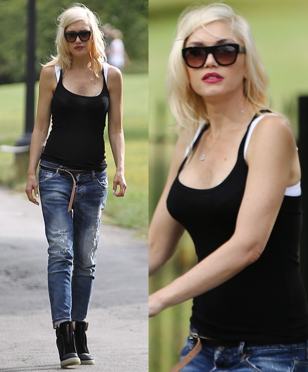 Gwen Stefani wearing a tank top and distressed jeans in London, England, on August 2, 2014