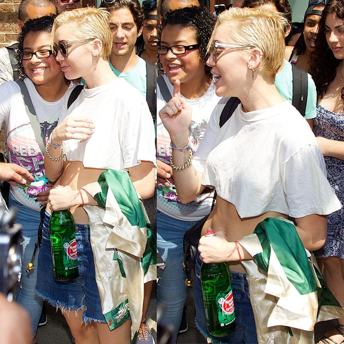 Miley Cyrus taking pictures with fans