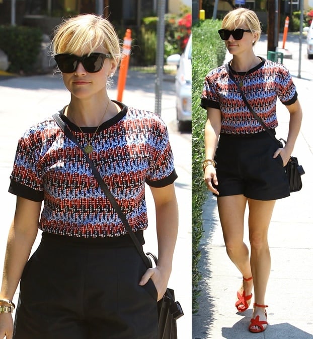 Reese Witherspoon in red, black, and blue as she checks out a new home