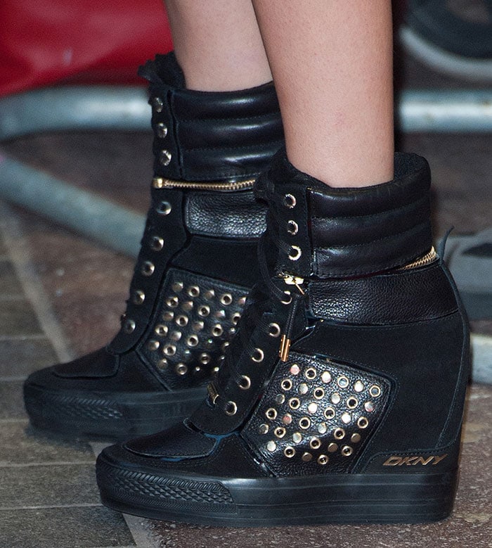 Cara Delevingne wearing DKNY wedge sneakers