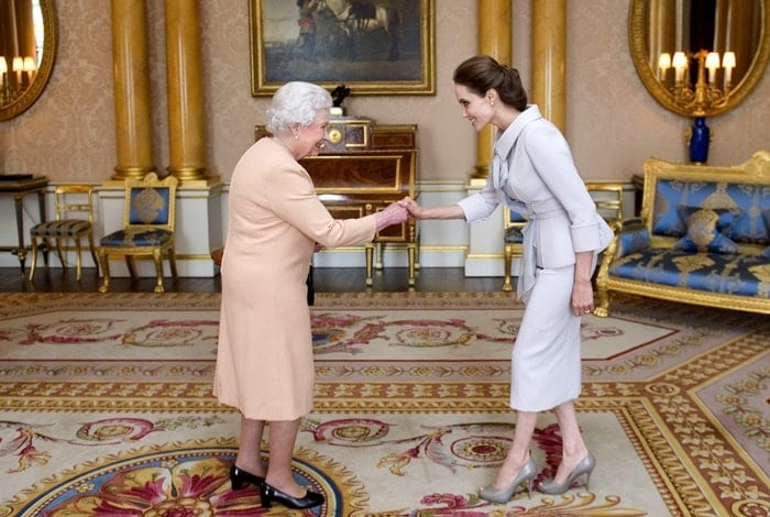 Angelina Jolie bowed to Queen Elizabeth II in the 1844 Room at Buckingham Palace on Friday morning in London