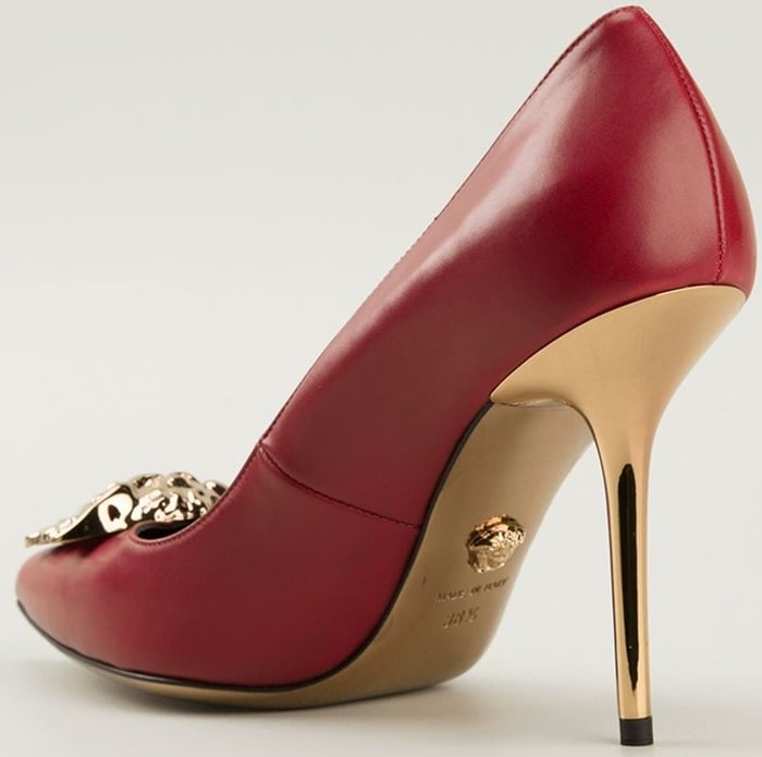 Red calf leather Idol pumps from Versace featuring pointed toes, a gold-tone Medusa head plaque on each vamp, and gold-tone stiletto heels