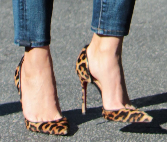 Reese Witherspoon shows off her feet in leopard Iriza pumps