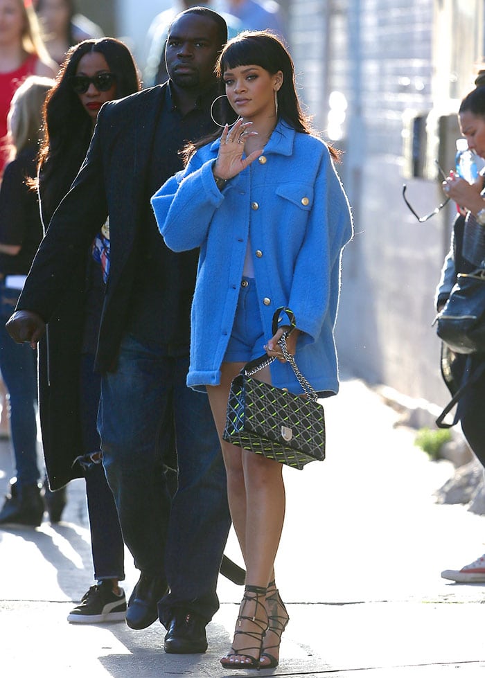 Rihanna flashed her enviable pins in an oversized blue coat by Moschino