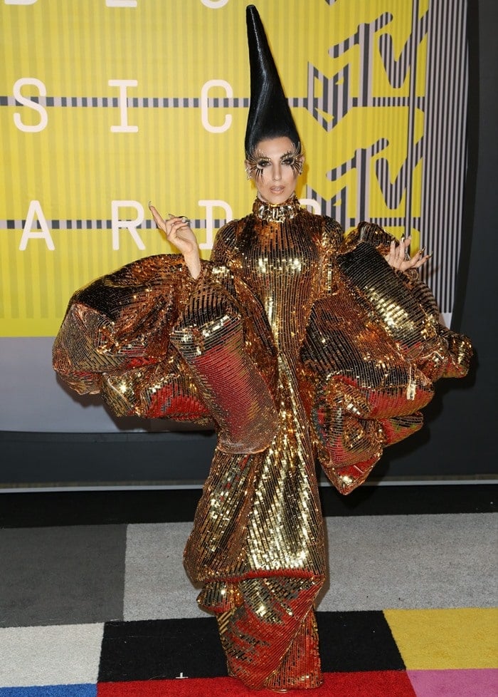 Z LaLa did not fail to turn heads in an impressive gold Christian Dior by John Galliano Spring 2004 Couture gown featuring giant, billow sleeves